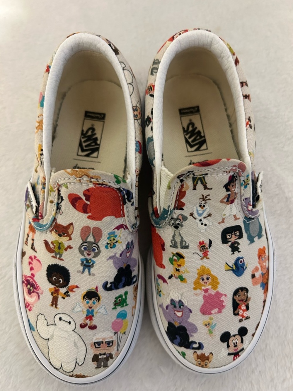 Vans Kids Disney 100 Year Anniversary White Slip-On Sneakers.